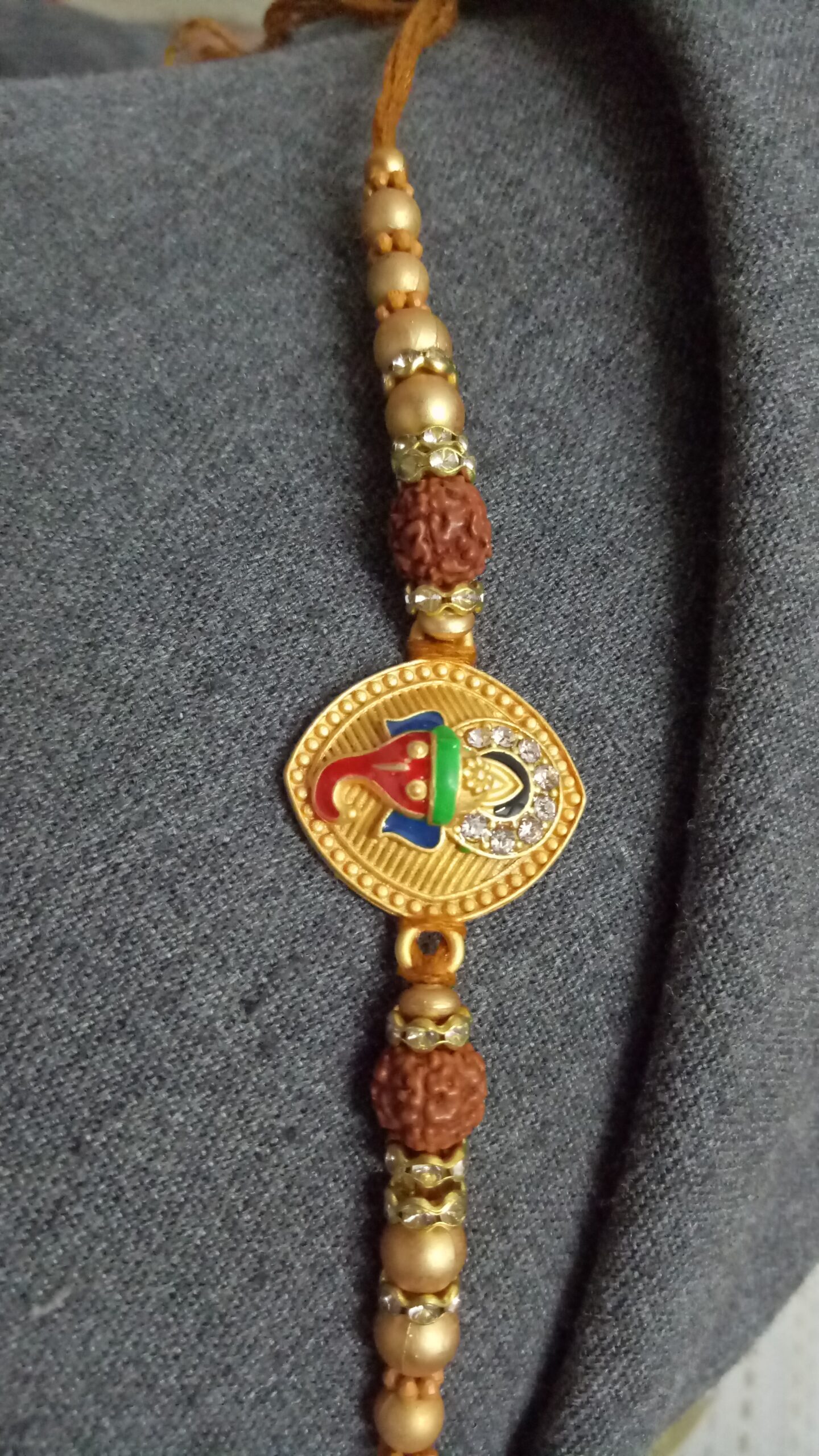 Metallic Ganesh Rakhi with Beads - Image 4