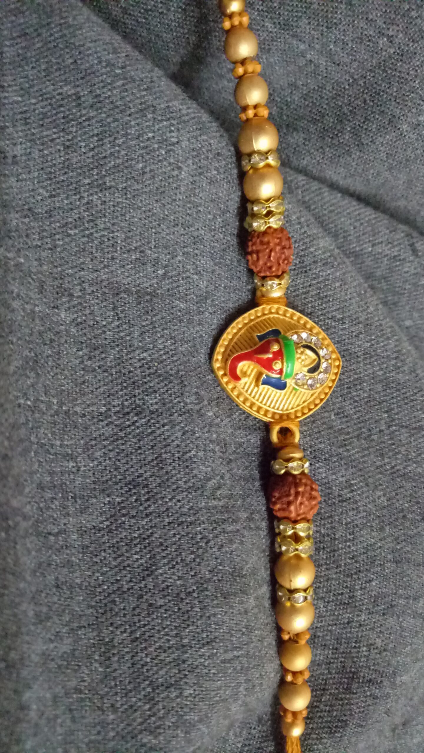 Metallic Ganesh Rakhi with Beads - Image 3
