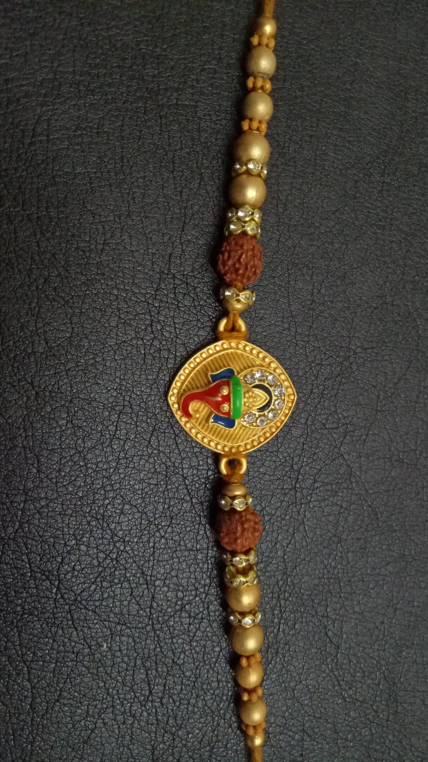 Metallic Ganesh Rakhi with Beads - Image 2