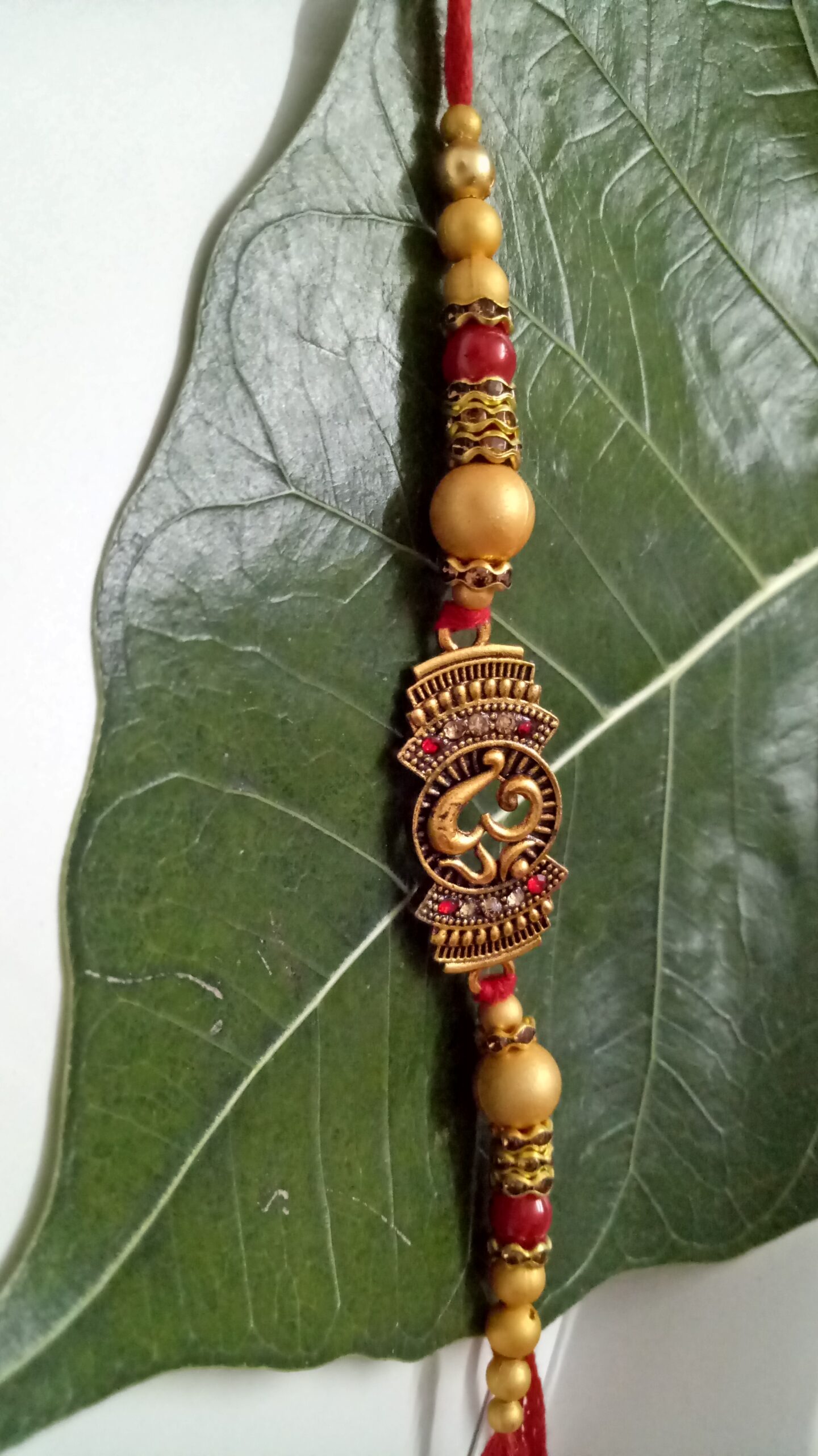 Om Designer Rakhi with Beads - Image 4