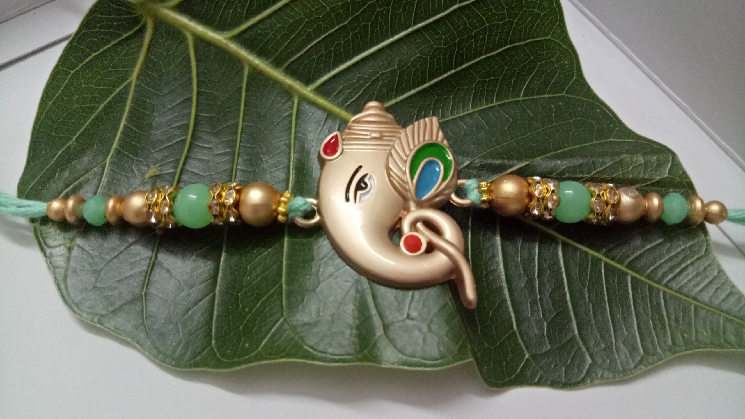 Ganesha with Peackok Fur Rakhi