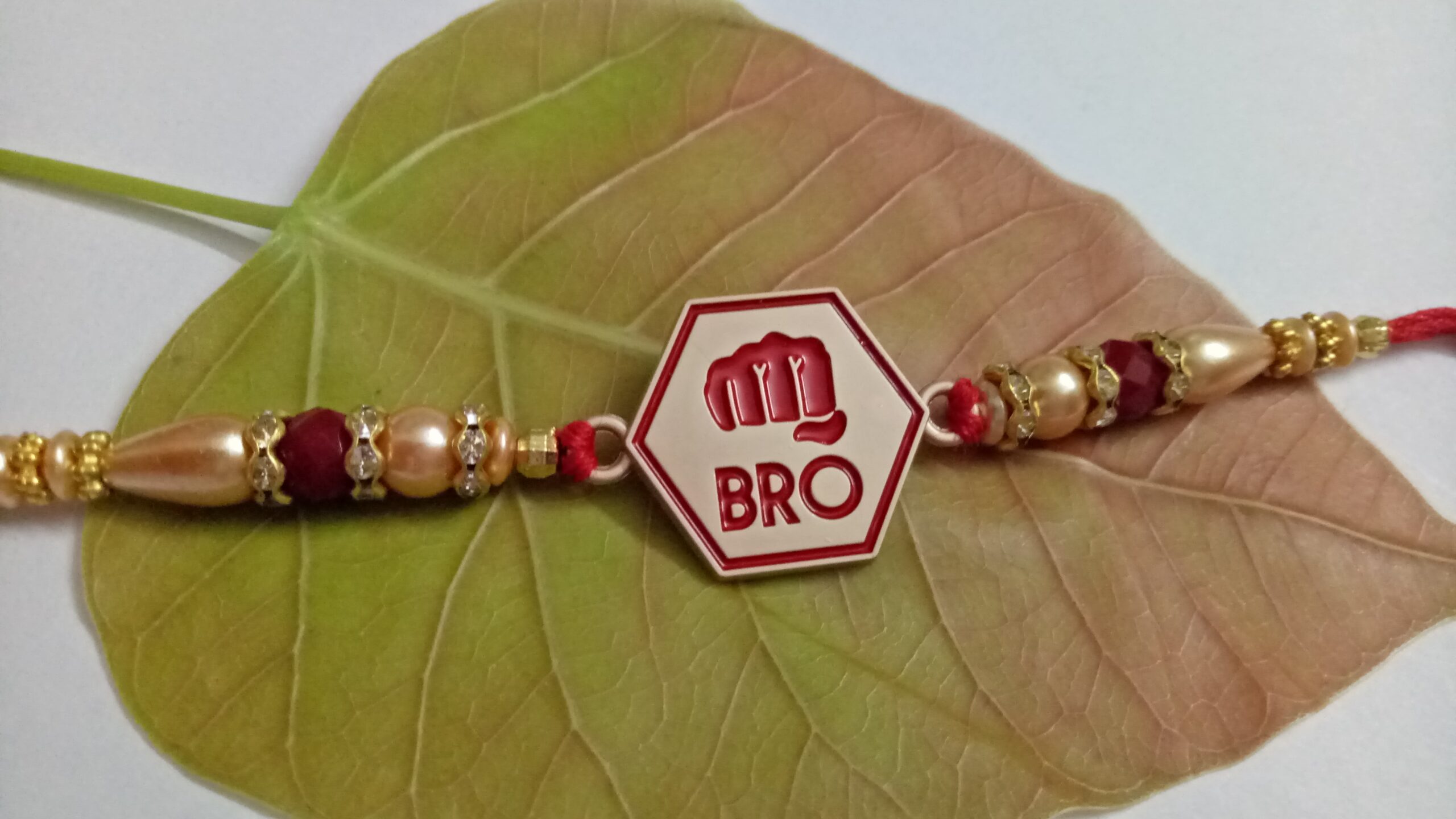 Metallic Bro Rakhi with Roli, chandan, rice & Misri
