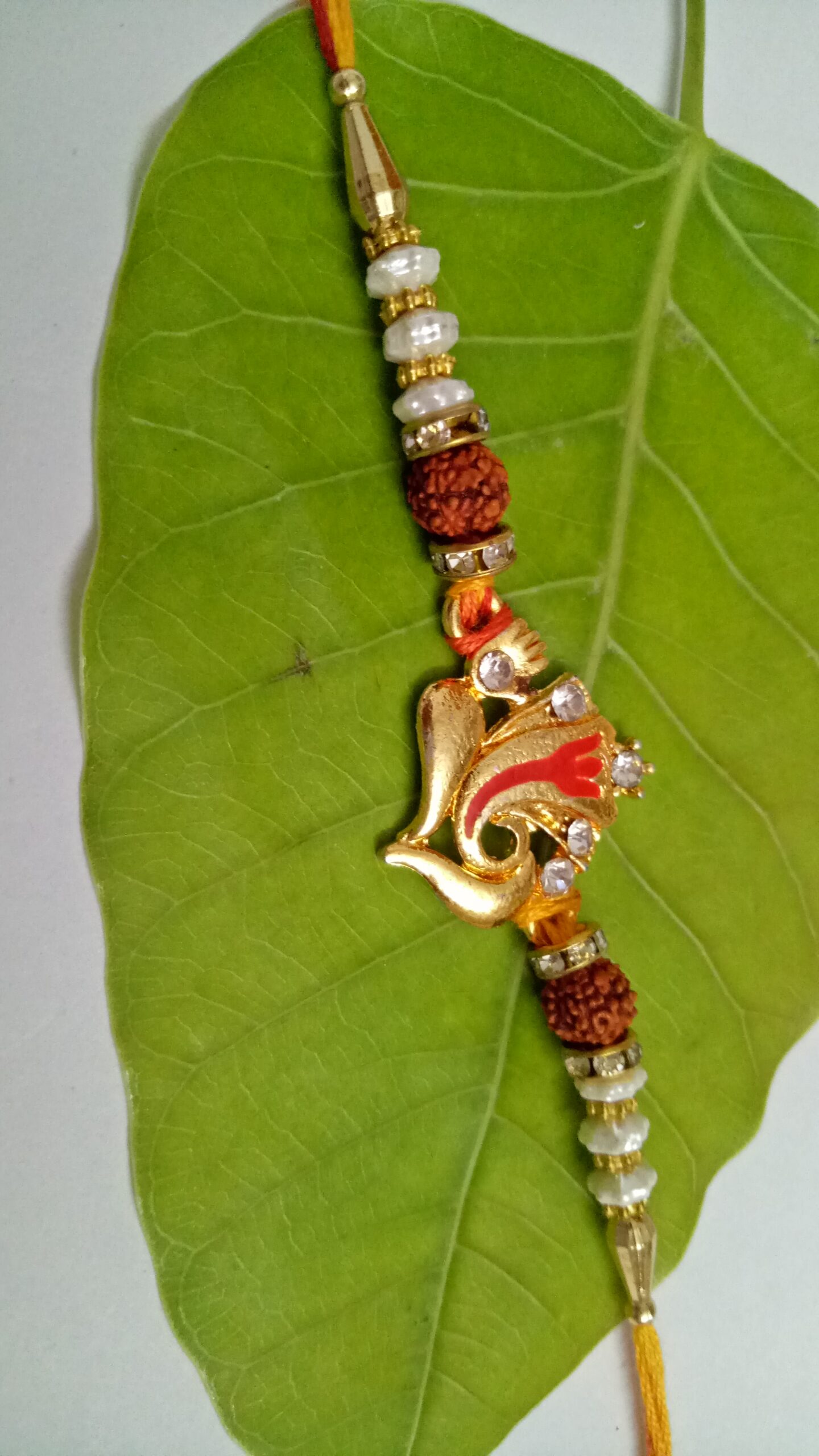 Metallic Ganesha Rakhi - Image 3